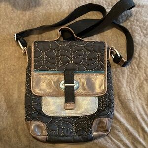 Black/brown leather Fossil bag with teal accents. Small messenger bag.